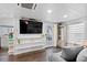 Living room with large TV and built-in shelving at 1306 Palmetto Blvd, Edisto Beach, SC 29438
