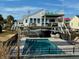 Private backyard pool with ample deck space at 1306 Palmetto Blvd, Edisto Beach, SC 29438
