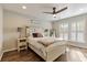 Bright bedroom featuring a rustic farmhouse bed, hardwood floors, and window shutters at 1504 Oldenburg Dr, Mount Pleasant, SC 29466