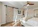 Bedroom with a barn door, hardwood floors, and a dresser at 1504 Oldenburg Dr, Mount Pleasant, SC 29466