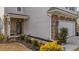 Side view of home showcasing stonework and landscaping at 1504 Oldenburg Dr, Mount Pleasant, SC 29466