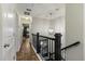 Upstairs hallway with hardwood floors and access to bedrooms at 1504 Oldenburg Dr, Mount Pleasant, SC 29466