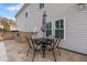 Small patio with table and chairs, adjacent to house at 1504 Oldenburg Dr, Mount Pleasant, SC 29466