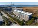 Luxury condos with water views and bridge in background at 155 Wingo Way # 418, Mount Pleasant, SC 29464
