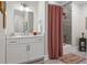Bathroom with white vanity and red shower curtain at 155 Wingo Way # 418, Mount Pleasant, SC 29464