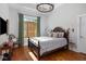 Bedroom with wooden bed and green curtains at 155 Wingo Way # 418, Mount Pleasant, SC 29464