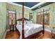 Charming bedroom with yellow floral wallpaper and wooden bed at 155 Wingo Way # 418, Mount Pleasant, SC 29464