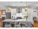 Modern kitchen with white cabinets, stainless steel appliances and large island at 155 Wingo Way # 418, Mount Pleasant, SC 29464