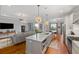 Open concept living space with hardwood floors and kitchen island at 155 Wingo Way # 418, Mount Pleasant, SC 29464