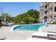 Community pool with lounge chairs for relaxation at 155 Wingo Way # 418, Mount Pleasant, SC 29464