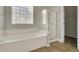 Bathroom with soaking tub, shower, and tile floor at 1857 Palmetto Isle Dr, Mount Pleasant, SC 29466