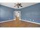 Empty bedroom with hardwood floors and blue walls at 1857 Palmetto Isle Dr, Mount Pleasant, SC 29466
