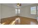 Light and airy bedroom with hardwood floors and large windows at 1857 Palmetto Isle Dr, Mount Pleasant, SC 29466