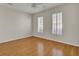 Well-lit bedroom with hardwood floors and window shutters at 1857 Palmetto Isle Dr, Mount Pleasant, SC 29466