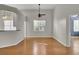 Hardwood floor dining room with kitchen and living room access at 1857 Palmetto Isle Dr, Mount Pleasant, SC 29466