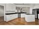 Bright kitchen with an island and white cabinets at 1857 Palmetto Isle Dr, Mount Pleasant, SC 29466