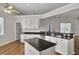 Modern kitchen featuring white cabinets, granite countertops, and stainless steel appliances at 1857 Palmetto Isle Dr, Mount Pleasant, SC 29466