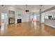 Open living room featuring hardwood floors and a fireplace at 1857 Palmetto Isle Dr, Mount Pleasant, SC 29466