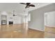 Hardwood floor living room with kitchen views and fireplace at 1857 Palmetto Isle Dr, Mount Pleasant, SC 29466