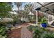Landscaped backyard with brick pathway and seating area at 209 Bennett St, Mount Pleasant, SC 29464