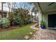 Landscaped backyard with stone path and lush greenery at 209 Bennett St, Mount Pleasant, SC 29464