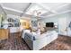 Bright basement with brick floors, comfortable seating and built-in shelving at 209 Bennett St, Mount Pleasant, SC 29464