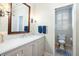 Elegant bathroom with marble vanity, and a separate toilet area at 209 Bennett St, Mount Pleasant, SC 29464