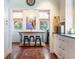 Charming breakfast nook with rustic table and metal stools at 209 Bennett St, Mount Pleasant, SC 29464