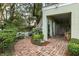 Brick patio with lush landscaping and charming seating area at 209 Bennett St, Mount Pleasant, SC 29464