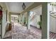 Long covered porch with brick floor and exterior access at 209 Bennett St, Mount Pleasant, SC 29464