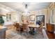 Bright dining room with a large table, chandelier, and hardwood floors at 209 Bennett St, Mount Pleasant, SC 29464