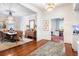Formal dining room with hardwood floors, chandelier, and large table at 209 Bennett St, Mount Pleasant, SC 29464