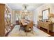 Elegant dining room with hardwood floors, chandelier, and decorative sideboard at 209 Bennett St, Mount Pleasant, SC 29464