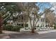 Two-story home with white picket fence, landscaping, and American flag at 209 Bennett St, Mount Pleasant, SC 29464