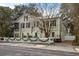 Charming two-story home with white picket fence and festive garland at 209 Bennett St, Mount Pleasant, SC 29464