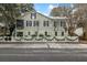Charming two-story home with white picket fence and festive garland at 209 Bennett St, Mount Pleasant, SC 29464