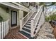 Exterior staircase with white railings leading to the home at 209 Bennett St, Mount Pleasant, SC 29464