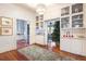 Bright hallway with built-in white cabinets and hardwood floors at 209 Bennett St, Mount Pleasant, SC 29464