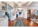 Elegant hallway with hardwood floors and built-in shelving at 209 Bennett St, Mount Pleasant, SC 29464