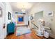 Spacious hallway featuring hardwood floors and chair lift at 209 Bennett St, Mount Pleasant, SC 29464