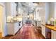 Spacious kitchen with white cabinets and hardwood floors at 209 Bennett St, Mount Pleasant, SC 29464