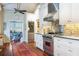 Modern kitchen with stainless steel appliances and white cabinets at 209 Bennett St, Mount Pleasant, SC 29464