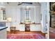 Built-in kitchen desk with white cabinets and wood countertop at 209 Bennett St, Mount Pleasant, SC 29464