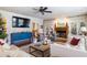 Bright living room boasts hardwood floors, fireplace, and ample natural light at 209 Bennett St, Mount Pleasant, SC 29464