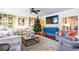 Spacious living room features hardwood floors, comfy seating, and a large TV at 209 Bennett St, Mount Pleasant, SC 29464