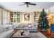 Bright living room with a Christmas tree and built-in shelving at 209 Bennett St, Mount Pleasant, SC 29464