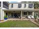Relaxing brick patio with seating and ceiling fans at 209 Bennett St, Mount Pleasant, SC 29464