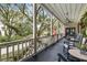 Spacious front porch with rocking chairs and lush landscaping at 209 Bennett St, Mount Pleasant, SC 29464
