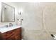 Charming powder room with marble vanity and nature-themed wall at 209 Bennett St, Mount Pleasant, SC 29464