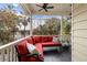 Relaxing screened porch with red sectional sofa and outdoor seating at 209 Bennett St, Mount Pleasant, SC 29464
